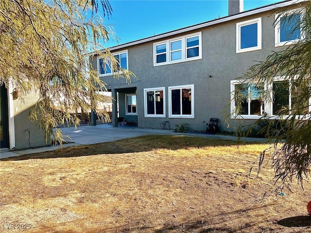 back of property featuring a patio area