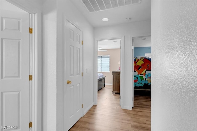 hallway featuring light wood-type flooring