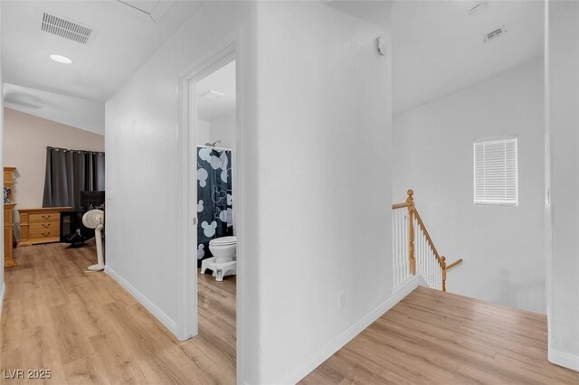 hall with light hardwood / wood-style flooring