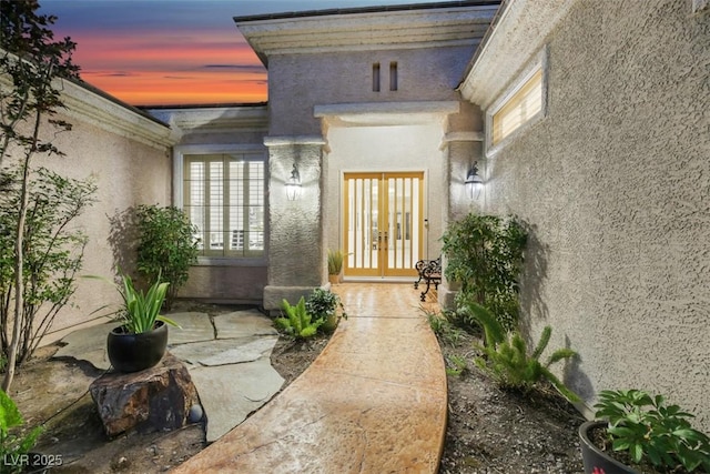 exterior entry at dusk with french doors