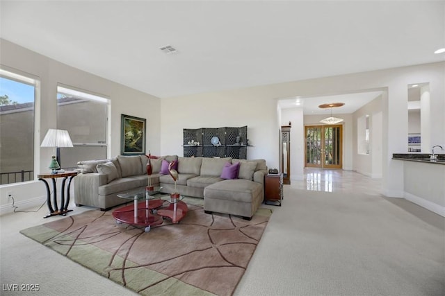 living room featuring light colored carpet