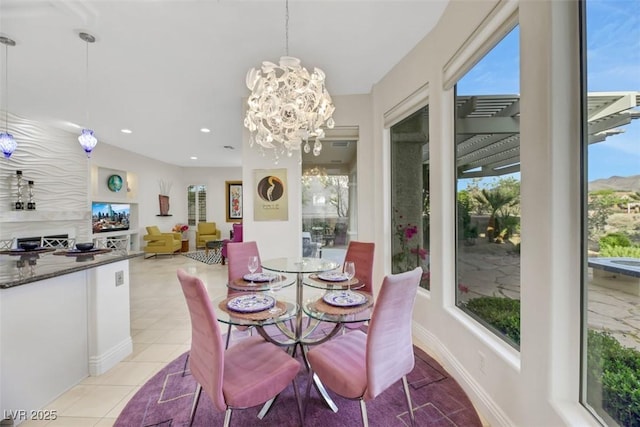 tiled dining space with a chandelier