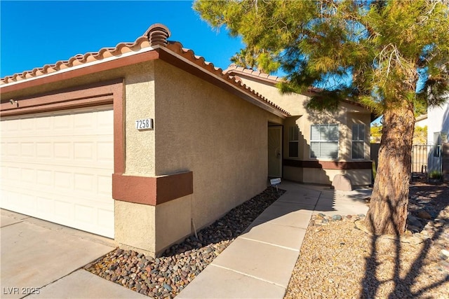 view of side of home with a garage