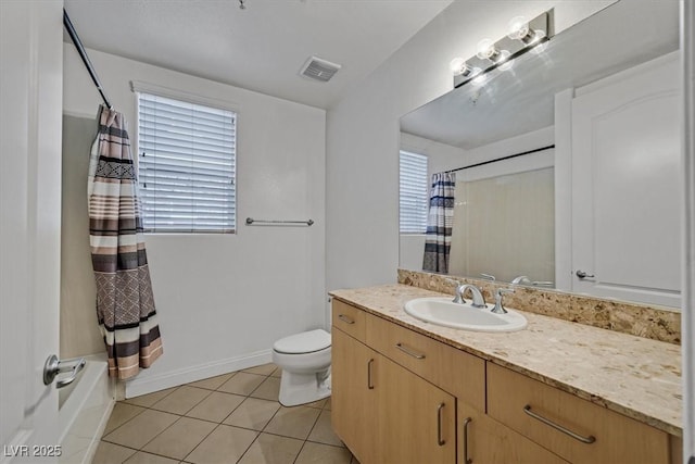 bathroom with plenty of natural light, tile patterned flooring, visible vents, and vanity