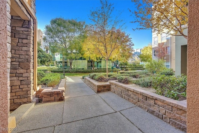 view of home's community with a patio area and fence