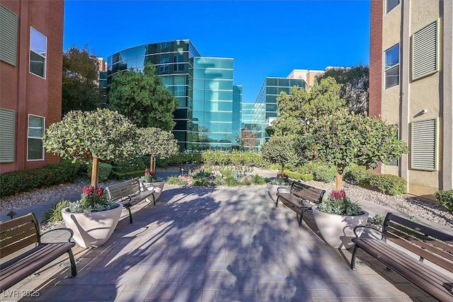 view of community with a patio area and a city view