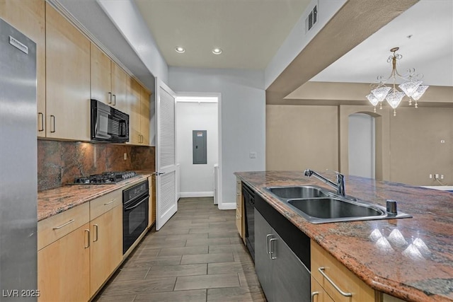 kitchen featuring black appliances, light brown cabinets, electric panel, and light stone countertops