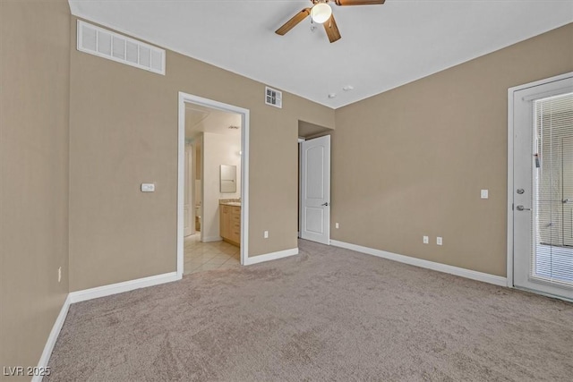 unfurnished bedroom with light colored carpet, visible vents, and baseboards