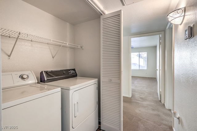 washroom featuring light carpet and independent washer and dryer