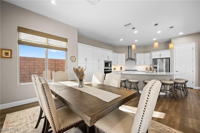 dining area featuring dark hardwood / wood-style floors