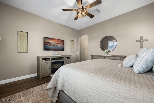 bedroom featuring dark hardwood / wood-style floors and ceiling fan