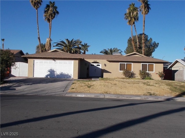 single story home featuring a garage