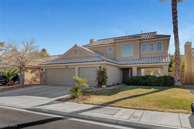 mediterranean / spanish-style house with a garage and a front lawn