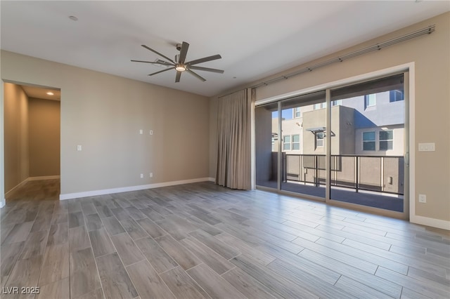 spare room with ceiling fan