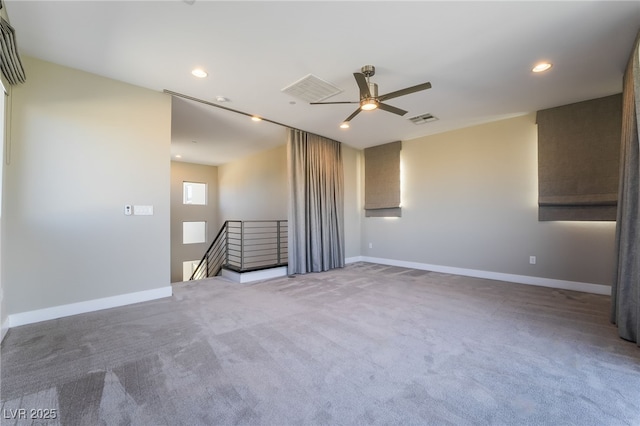 empty room with ceiling fan and carpet