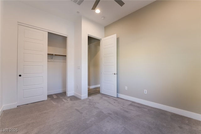 unfurnished bedroom featuring carpet floors, a closet, and ceiling fan