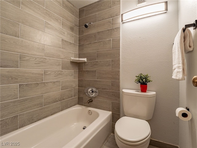 full bath with washtub / shower combination and toilet