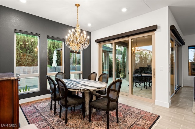 dining area featuring an inviting chandelier