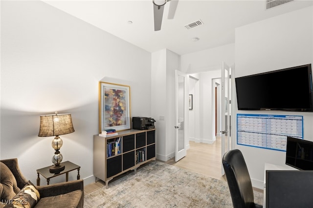 office area featuring light hardwood / wood-style floors and ceiling fan