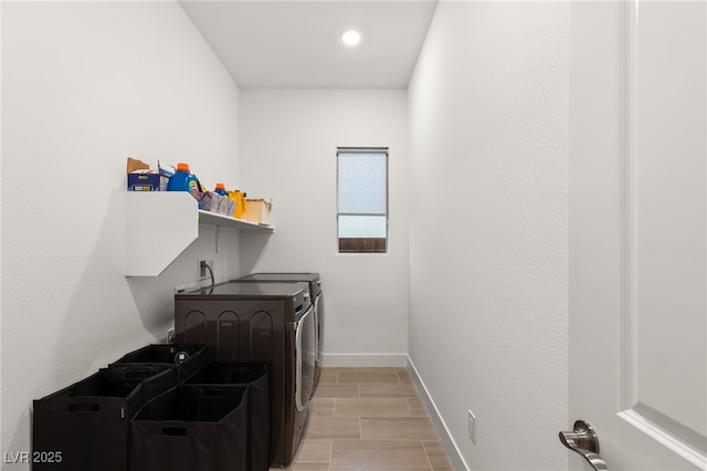 clothes washing area featuring washing machine and dryer