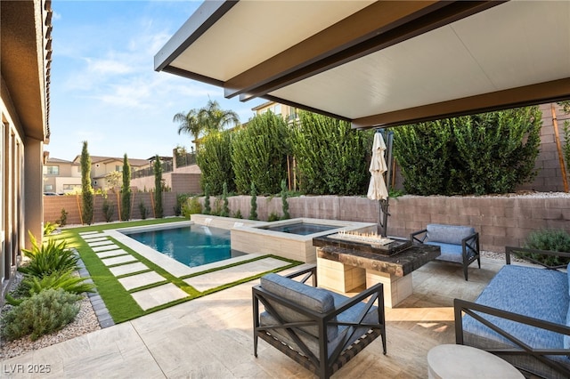 view of swimming pool with a hot tub, pool water feature, an outdoor fire pit, and a patio area