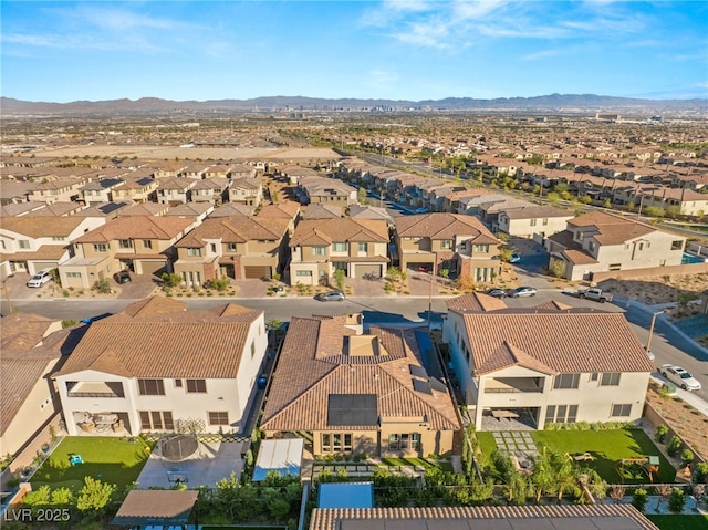 birds eye view of property featuring a mountain view