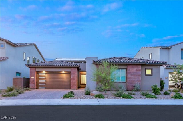 view of front of home with a garage