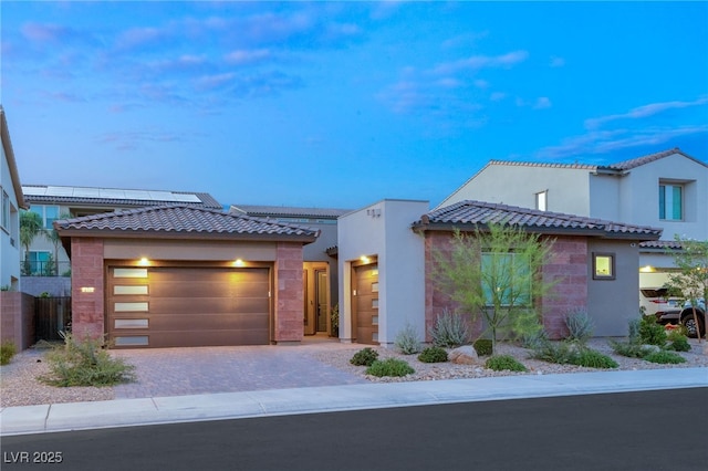 view of front of property with a garage