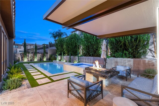 view of swimming pool featuring a fire pit and a patio area