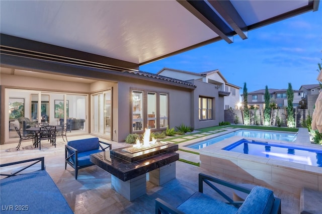 view of pool with an in ground hot tub, an outdoor fire pit, and a patio