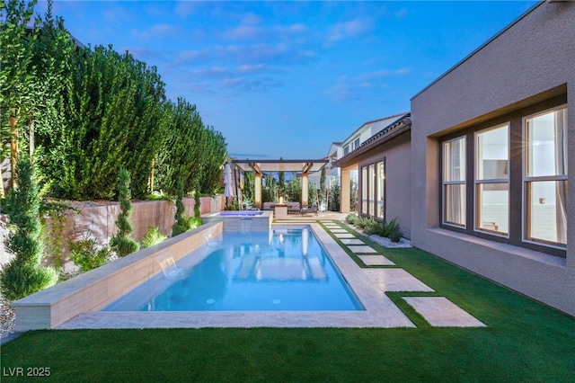 view of swimming pool with a yard, a patio area, pool water feature, and an in ground hot tub