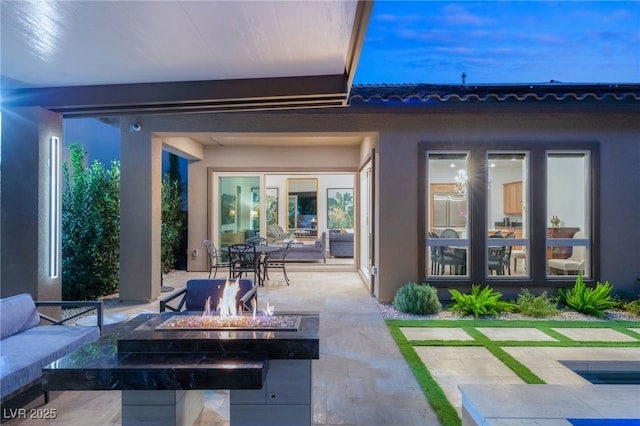 view of patio with a fire pit