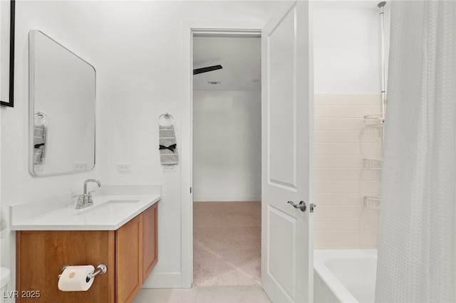 bathroom featuring vanity and shower / bath combination with curtain