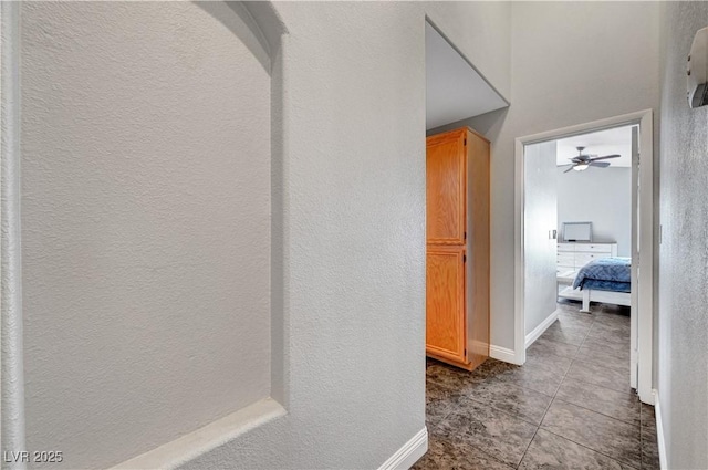 hall with light tile patterned floors