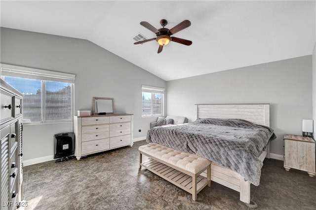 bedroom featuring lofted ceiling, heating unit, and ceiling fan