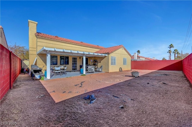 back of house with a patio