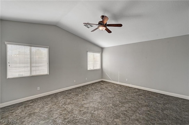 unfurnished room featuring vaulted ceiling and ceiling fan