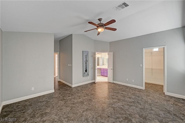 unfurnished room with ceiling fan and vaulted ceiling