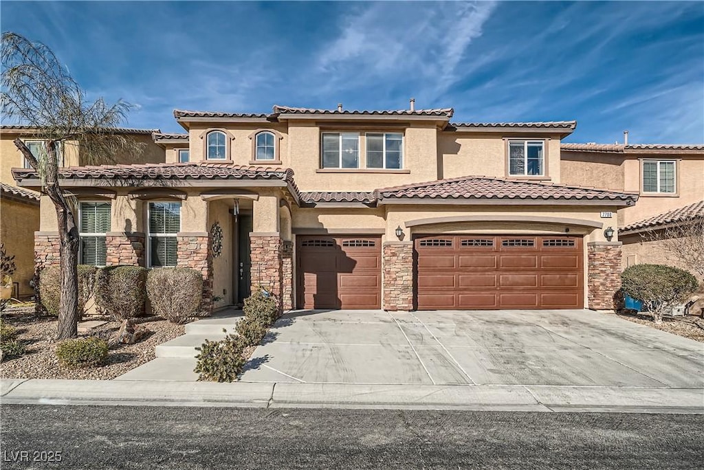 mediterranean / spanish-style house with a garage