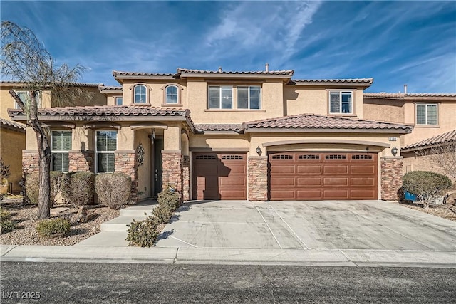 mediterranean / spanish-style house with a garage