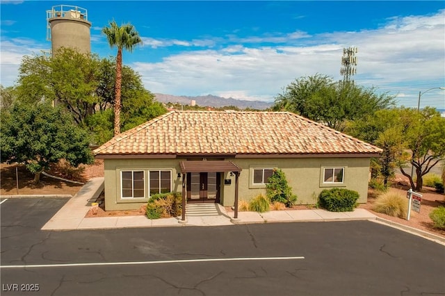 mediterranean / spanish home featuring a mountain view