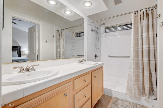 bathroom with vanity and walk in shower