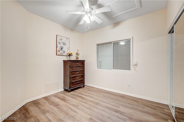 bedroom featuring a closet, light hardwood / wood-style floors, and ceiling fan