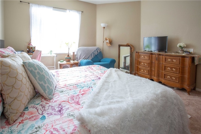 bedroom featuring light colored carpet