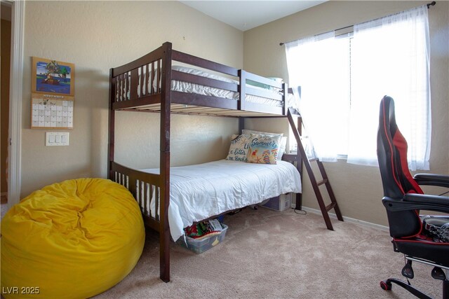 bedroom with carpet flooring, multiple windows, and baseboards