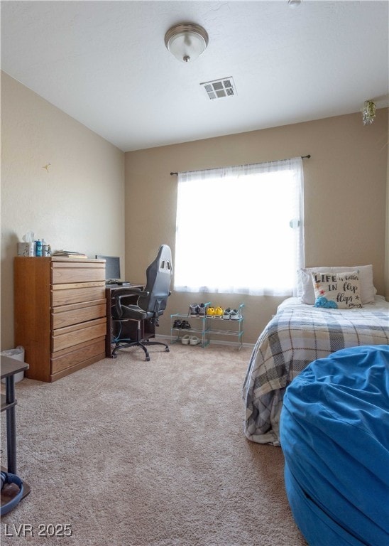 bedroom with visible vents and carpet floors