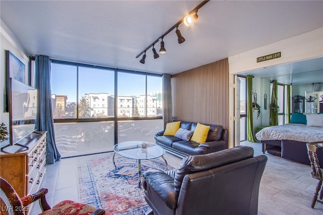 living room featuring a textured ceiling and expansive windows