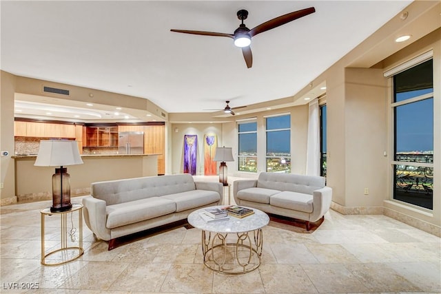 living room featuring ceiling fan