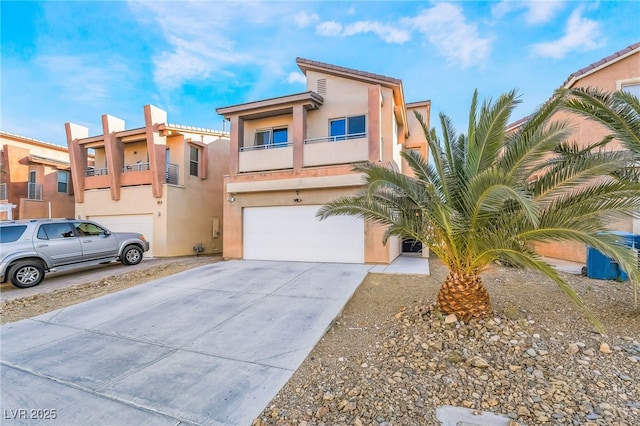 view of front of property with a garage and a balcony