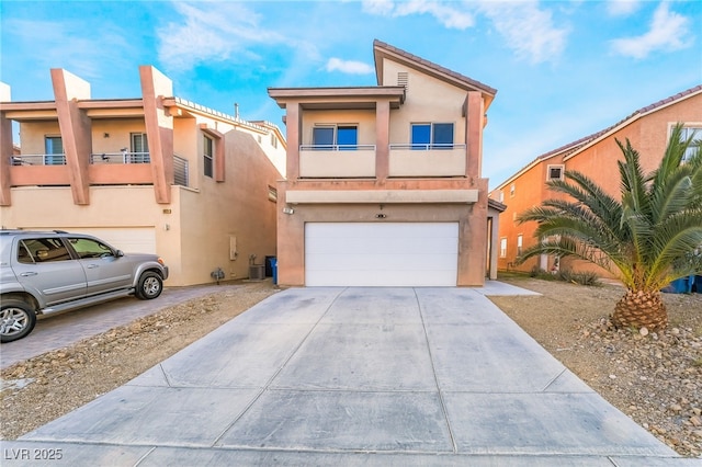 view of front of house featuring a balcony and a garage